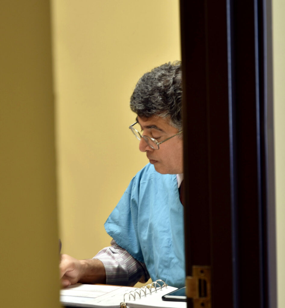 Dr. Norooz putting a dental plan together